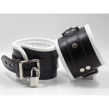 Wide handcuffs made of premium leather in black combined with white