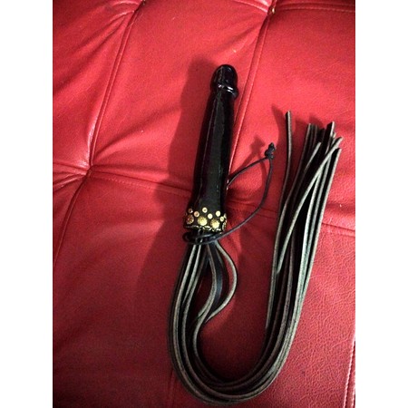 Flogger made of high quality leather with a wooden handle in the shape of a penis by Chen Kazaroff​