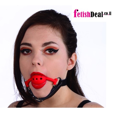 Red silicone gag with chin strap made of black faux leather