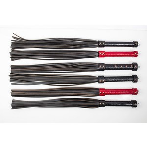 High quality handmade leather flogger with a handle in red faux snake skin texture with dense tails​​​​