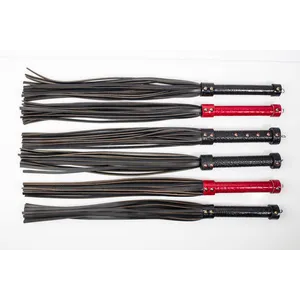 High quality handmade leather flogger with a handle in red faux snake skin texture with dense tails​​​​