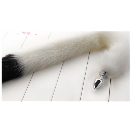 Long white tail with a black tip made of faux fur with a small metal plug