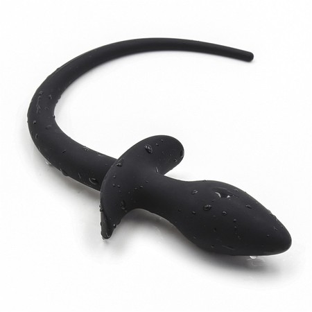 Large black plug in the shape of a dog tail