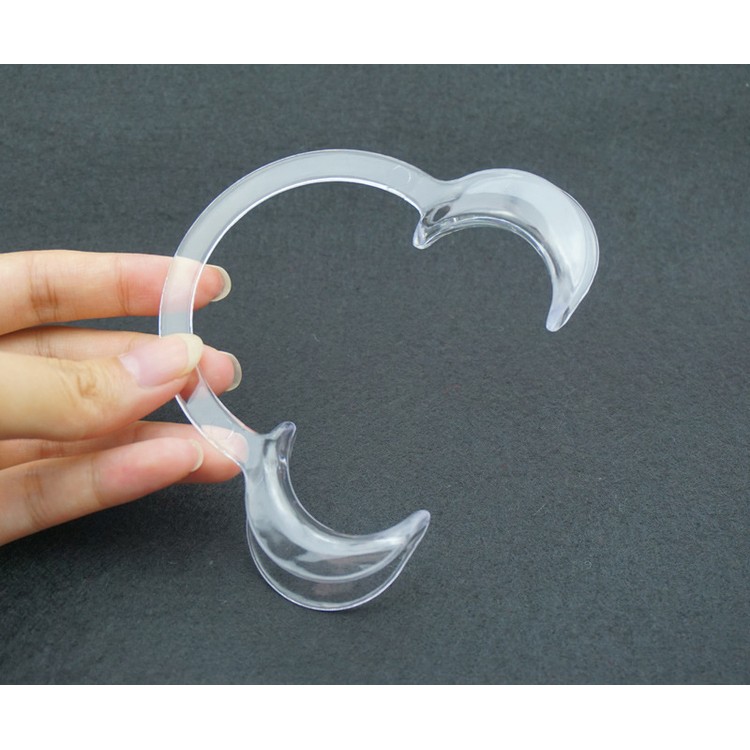 תומך החיוכים - מתקן פלסטיק לפעירת הפה